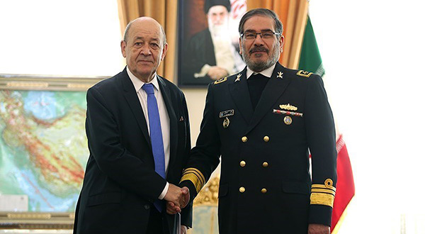 French Foreign Minister Jean-Yves Le Drian (L) meets Secretary of Iran's Supreme National Security Council Ali Shamkhani in Tehran, March 5, 2018
